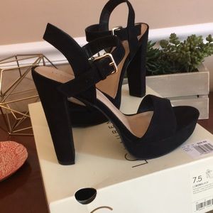 Black platform pumps